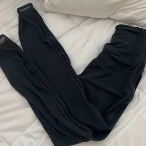 Athleta legging in dark grey with mesh/cut outs down leg. Size xxs